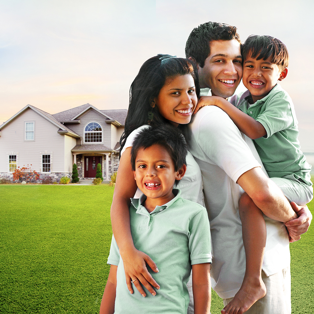 Family standing in front of a house